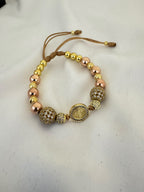 Pulsera San Benito Oro Rosa + Bola de Fuego