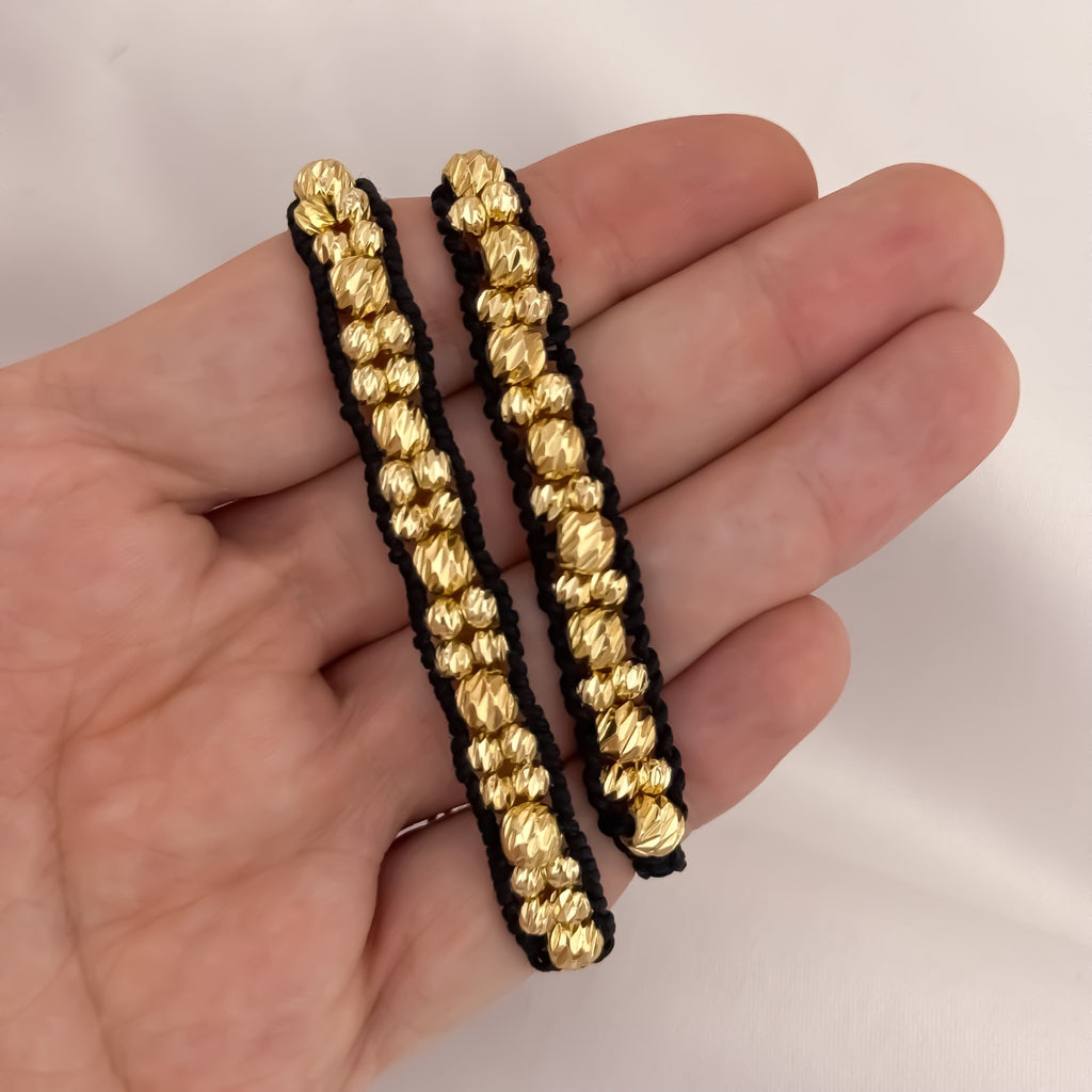 Dúo Pulseras Negro y Oro · 3 Carriles